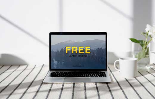 Free Laptop on a Table Mockup