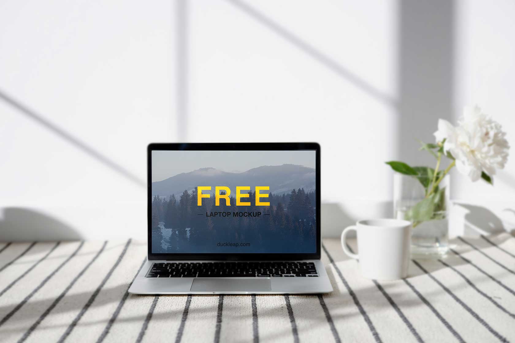 Free Laptop on a Table Mockup